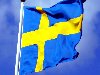 Фото флага Швеции на фоне синего неба
