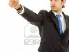 Молодой деловой человек в костюме, указывая пальцем Фото со стока - 10977638