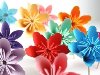 ... интересный способ как сделать цветы из цветной бумаги в технике оригами.