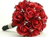 Свадебный букет из красных роз с бижутерией